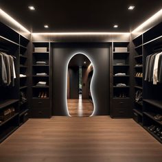 an empty walk in closet with lots of clothes