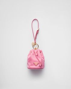 Detachable leather wristlet Enameled metal triangle logo Pink Prada Bag, Fem Outfits, 3d Keychain, Tiny Bags, Pinterest Predicts, Cute School Bags, Pink Pouch