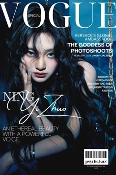 a woman with long black hair on the cover of a magazine