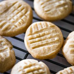 some cookies are cooling on a rack and ready to be baked in the oven for consumption