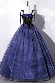 Evoke the magic of a starlit night with this captivating midnight blue velvet gown. The luxurious fabric is tailored to perfection, featuring a fitted bodice that gracefully flows into a full, floor-length skirt. Golden thread embellishments meander across the gown like constellations, catching the light and ensuring youre the center of attention.The gowns square neckline and delicate spaghetti straps highlight the shoulders and create an elegant frame for statement jewelry. Its cinched waist is Blue Velvet Gown, Tulle Long Prom Dress, Blue Party Dress, Velvet Gown, Star Blue, Wholesale Dress, Prom Dresses Blue, Evening Party Dress, Long Prom Dress