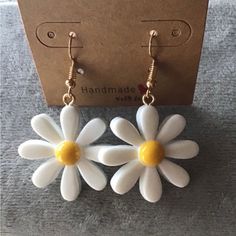 White Daisy Earrings Handmade New/ Unused Approximately 2 Inches From The Top Of The Hook To The Bottom Of The Flower Trendy Handmade Yellow Flower Earrings, Trendy Handmade White Flower Earrings, Trendy White Handmade Flower Earrings, Trendy White Flower Earrings For Gift, Trendy White Flower Earrings As Gift, White Earrings For Everyday Spring Wear, Cute White Flower Earrings For Summer, Cute White Dangle Flower Earrings, Clay Activities