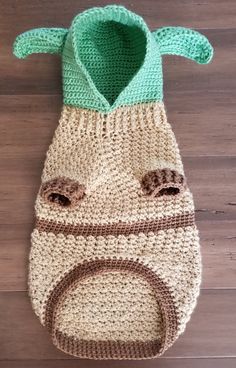 a crocheted bag with an animal's face on the front and bottom