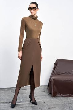 This top is designed with a snug fit and a turtle neck for added warmth. Made with high-quality knitted fabric, it is both stylish and comfortable to wear. Perfect for those looking for a chic addition to their wardrobe. Length: 56cm (Top), 60cm(Sleeve) Chic Brown A-line Skirt, Luxury Brown Formal Skirt, Luxury Brown Midi Skirt, Luxury Brown Asymmetrical Skirt, Brown Non-stretch Midi Skirt, Lace Knit Top, Cotton Blazer, Crepe Fabric, Lace Knitting