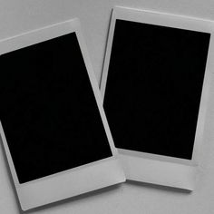 two polaroid frames sitting side by side on top of a white surface with one black square in the middle