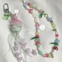 a necklace with beads and charms attached to it