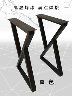 two black metal structures with chinese writing on them and an image of water in the background