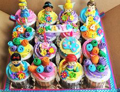 there are many cupcakes that have been decorated in the shape of children's characters