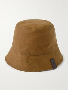 Loewe's bucket hat gives you two-in-one. One side comes in camel waxed cotton-canvas and the other a wool and cotton-blend patterned with a multicoloured check. A logo-embossed leather tab is stitched to its brim. Brown Cotton Flat Brim Bucket Hat, Outdoor Brown Cotton Bucket Hat, Brown Reversible Bucket Hat With Curved Brim, Bucket Hat For Men, Mens Bucket Hats, Hat For Men, Summer Sunglasses, Loungewear Shorts, Fine Jewelry Designers