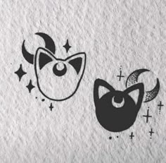 two black and white drawings of cats with stars on the side, one has a cat's head