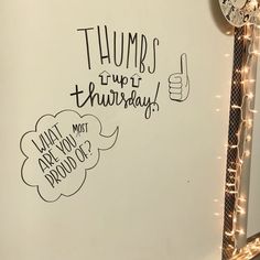 a white board with writing on it that says thumbs up thurreboy and an alarm clock