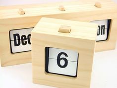 two wooden blocks with numbers on them