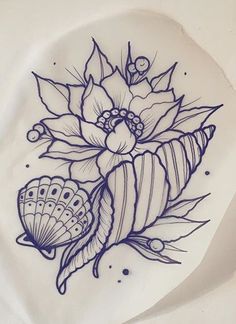 a white plate with blue ink on it that has flowers and shells in the middle