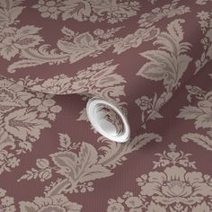 an image of a wallpaper with flowers and leaves on the background in shades of brown