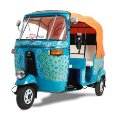 a small blue and orange vehicle with an orange roof on the front, parked in front of a white background