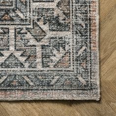 an area rug is shown on the floor with wood floors and hardwooding in the background