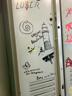 two white lockers with graffiti on them