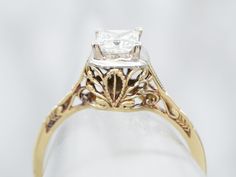 Completely unique and one of a kind! Made of 18-karat yellow gold with a white gold mounting, this ring is a modern update on the classic Art Deco settings of the 1920s. The main focus is the excellent, square-cut diamond adorning the center, flush-set so that the diamond sits perfectly flat inside the setting. Accenting the diamond perfectly is a geometric topped basket setting. The intricate filigree work featured scrolling details and allows plenty of light to flow through the stone. Truly unique!Metal: 18K Yellow and White Gold Gem: Diamond .38 Carats, G in Color, SI2 in Clarity Gem Measurements: 4.1 x 4.2 mm, Square Princess Cut Ring Size: 4.75 European Cut Diamond Ring, Art Deco Filigree, Filigree Engagement Ring, Basket Setting, Princess Cut Rings, Engagement Ring Diamond Cut, Princess Cut Diamond, White Gold Engagement, Oval Cut Diamond