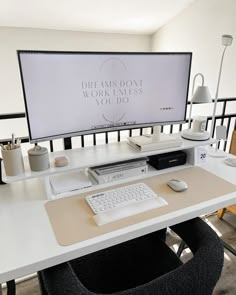 a desk with a monitor, keyboard and mouse on it