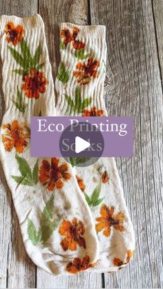 two socks with orange flowers on them and the words eco printing soks written in purple