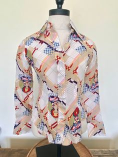 "70s White Tara unique print blouse White Tara is the Bodhisattva of compassionate activity This rare and pristine blouse is in excellent vintage condition Looks like it has never been worn. White buttons Two button cuffs Brand - Jeune Belles Tag size 7/8, most likely a xsmall/small, go by the measurements 100% Rayon FREE SHIPPING Measurements laying flat: Bust - 16\" Sleeve - 21\" Length - 21.5\"" Retro Patterned Printed Shirt, White Vintage Top With Vintage Print, Multicolor Retro Blouse With Retro Print, Vintage Fitted Printed Tops, Vintage Multicolor Abstract Print Tops, Fitted Vintage Printed Tops, Retro Patterned Shirt With Abstract Print, Retro Cotton Blouse With Retro Print, Cotton Retro Blouse With Retro Print