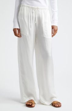 If you must step away from your pool chaise or beach towel, pop on some cotton pants closed with a comfy drawstring. Drawstring waist Front patch pockets 100% cotton Machine wash, line dry Imported White Linen Lounging Bottoms, Relaxed White Wide Leg Bottoms, Comfortable White Beach Pants, Comfortable White Beach Bottoms, White Bottoms With Drawstring And Long Pants, White Drawstring Long Pants, Relaxed White Linen Bottoms, Relaxed White Bottoms With Pockets, Comfortable White Bottoms With Loosely Fitted Hips