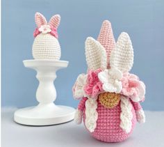 two crocheted easter bunnies sitting next to each other