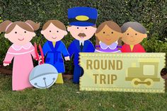 a group of people standing next to a round trip sign