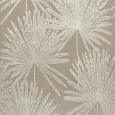 a beige and white wallpaper with large leaves on it