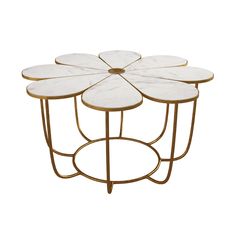 four white flower shaped side tables on metal bases with gold legs and round tops, set against a white background