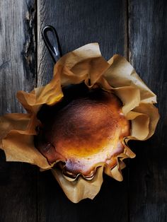 a baked pastry sitting on top of a wooden table