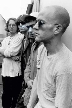 black and white photograph of three men standing next to each other