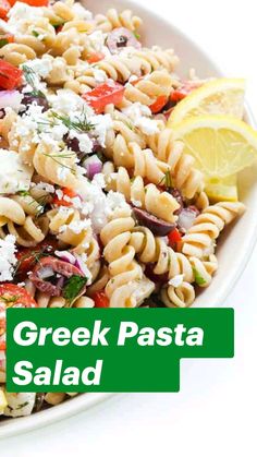 a pasta salad with feta cheese and tomatoes