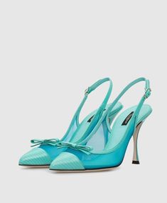 These Dolce & Gabbana mesh slingback pumps reek of elegance. Don't let their classic shape fool you, as the blue leather, mesh panelling, and slim bows add a glamorous, feminine touch. Perfect for strutting your stuff with a pointed toe, contrasting toe cap, slingback ankle strap, and sky-high stiletto heel. Finished with a leather sole. Model: Slingback heels Color: Light Blue Material: 60% PA+40% Calf Leather Buckle closure Leather bottom sole Made in Italy Luxury Mesh Heels, Luxury Mesh Heels For Formal Occasions, Luxury Formal Slingback Pumps With Bow Straps, Luxury Party Heels In Mesh, Luxury Mesh Heels For Party, Luxury Party Mesh Heels, Luxury Slingback Pumps With Bow Straps For Evening, Luxury Evening Slingback Pumps With Bow Straps, Luxury Blue Slingback Pumps For Party