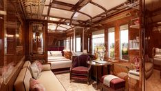 the interior of a train car with wood paneling and furniture, including a bed