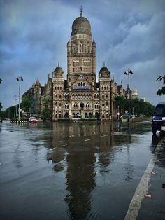 an old building is sitting in the middle of a flooded street