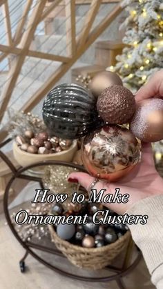 a person holding ornaments in their hand with the words how to make ornament clusters