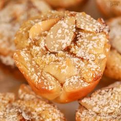 powdered sugar covered pastries sitting on top of each other