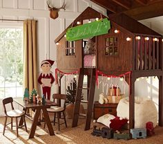 a room with a bunk bed and christmas decorations on the walls, along with other furniture