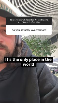 a man wearing a hat and holding a cell phone to his ear with the caption do you actually love vermont? it's the only place in the world