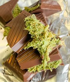 there are chocolate bars with green toppings on them