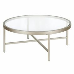 a round glass table with metal legs