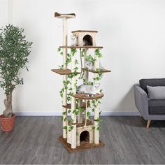 a cat tree in the middle of a living room next to a couch and potted plant