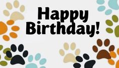 an image of happy birthday card with dog paw prints