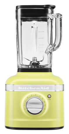 a yellow blender sitting on top of a white table