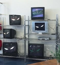 there are many televisions and monitors on the shelves