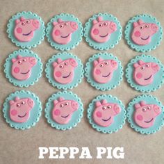 twelve peppa pig cupcake toppers in pink and blue