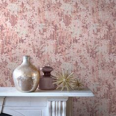 two vases sitting on top of a white mantle in front of a pink wall