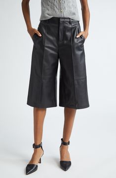 A longer length brings edgy style to these leather shorts that'll smoothly slip into high rotation with their versatile design. 16" inseam; 26" leg opening; 11" front rise; 13 1/2" back rise (size 8) Zip fly with hook-and-bar closure Front slant pockets; back welt pockets Leather Professional leather clean Imported Knee-length Faux Leather Bottoms For Spring, Spring Knee-length Faux Leather Bottoms, Fitted Short Leather Bottoms, Short Leather Bottoms With Belt Loops, Knee-length Faux Leather Bottoms For Night Out, Fitted Faux Leather Knee-length Bottoms, Fitted Knee-length Faux Leather Bottoms, Sleek Knee-length Spring Bottoms, Edgy High Waist Leather Bottoms