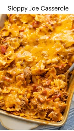 a casserole dish with meat, cheese and pasta in it on a table